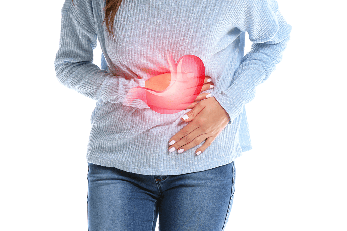 お腹をおさえる様子